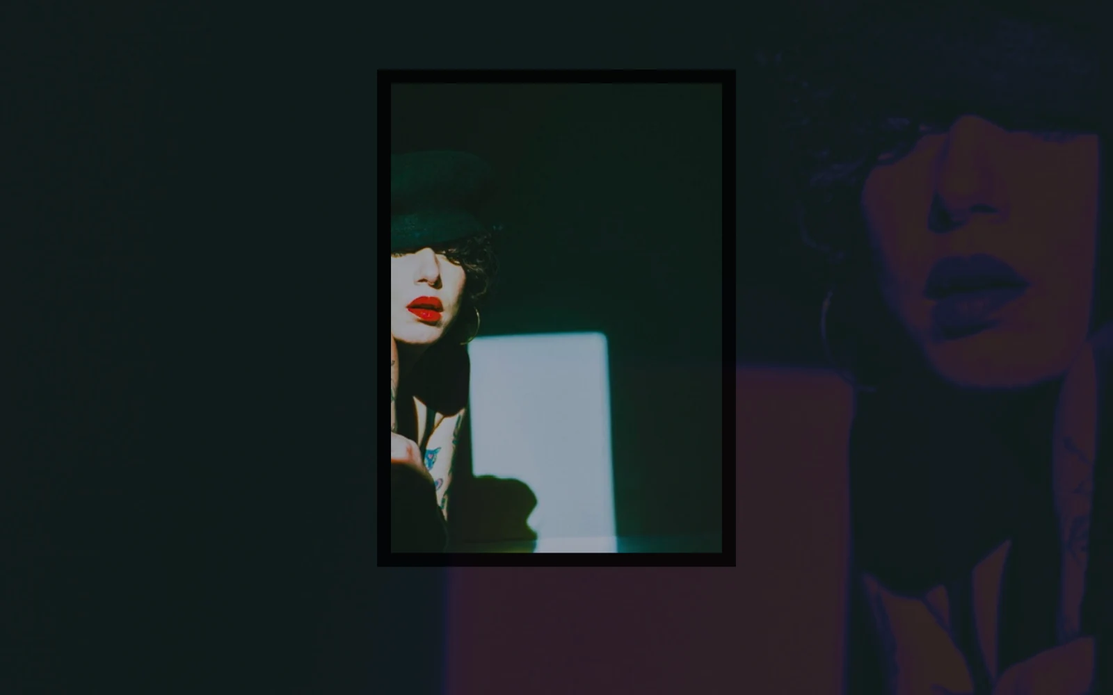 Layered conceptual self-portrait in deep green and red tones